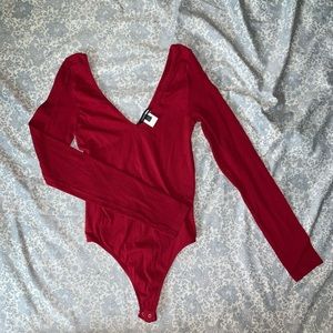 Red Fashion Nova body suit. Size S/M